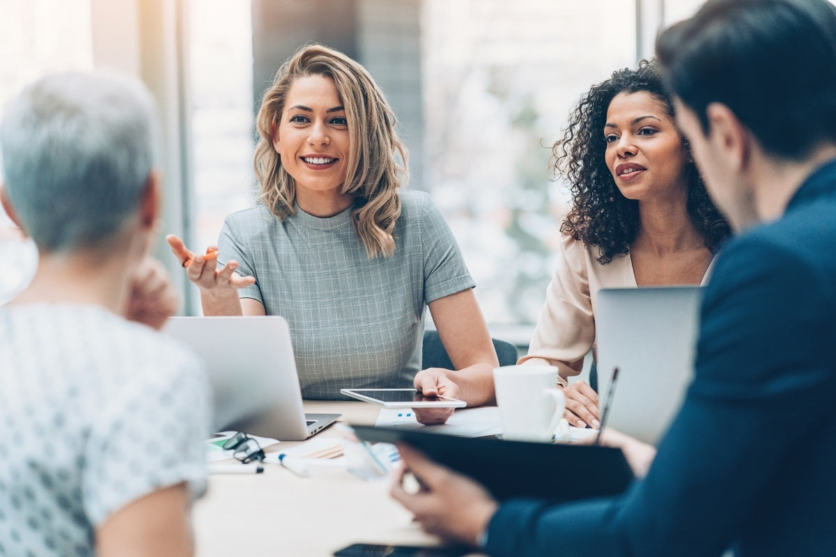 Group of professionals having a collaborative discussion in an office setting