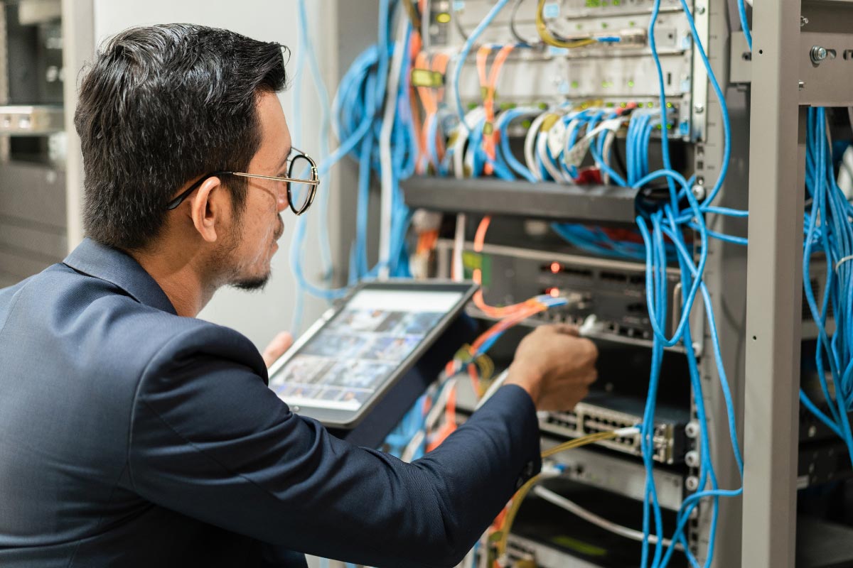 it technician with tablet structures network cabling