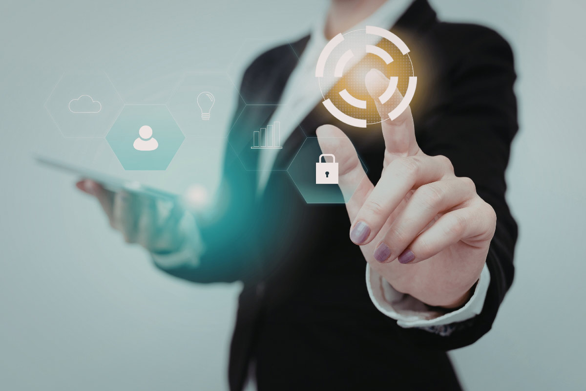 Business professional using a tablet and digital security interface representing centralized security oversight for multi-location organizations.